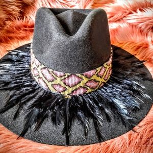 Hats embellished with feather art and beaded